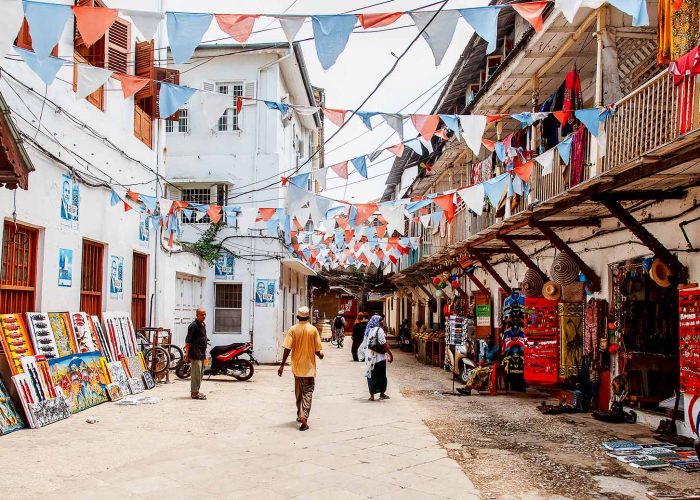 Stone Town: Local people on a street in Stone Town. Stone Town is the old part of Zanzibar City, the capital of Zanzibar, Tanzania